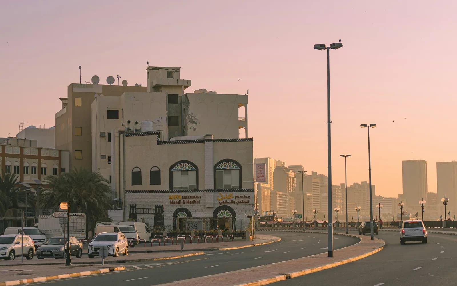 Street of low-rise buildings in an older Dubai district