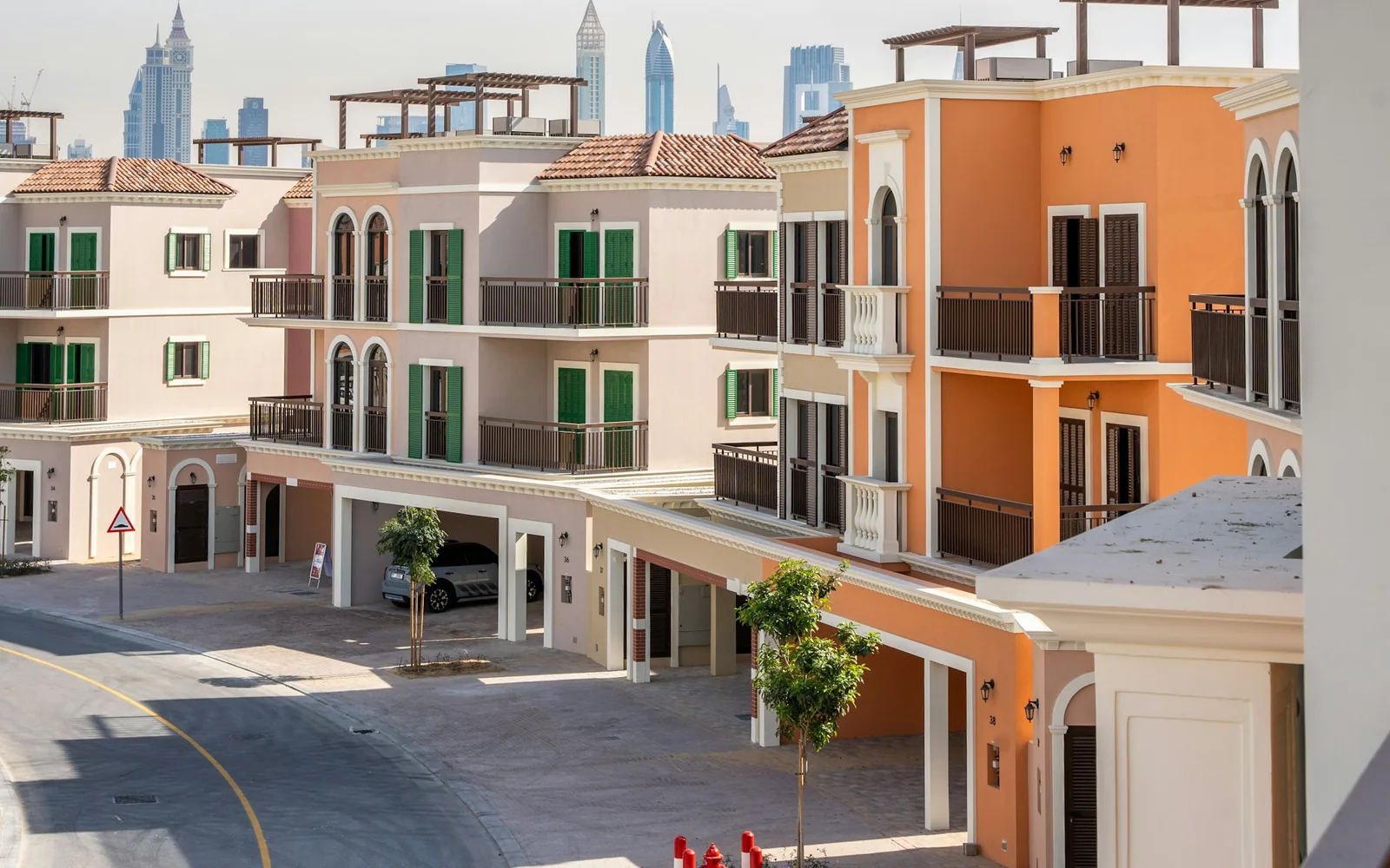 Low-rise residences with the Dubai skyline in the distance