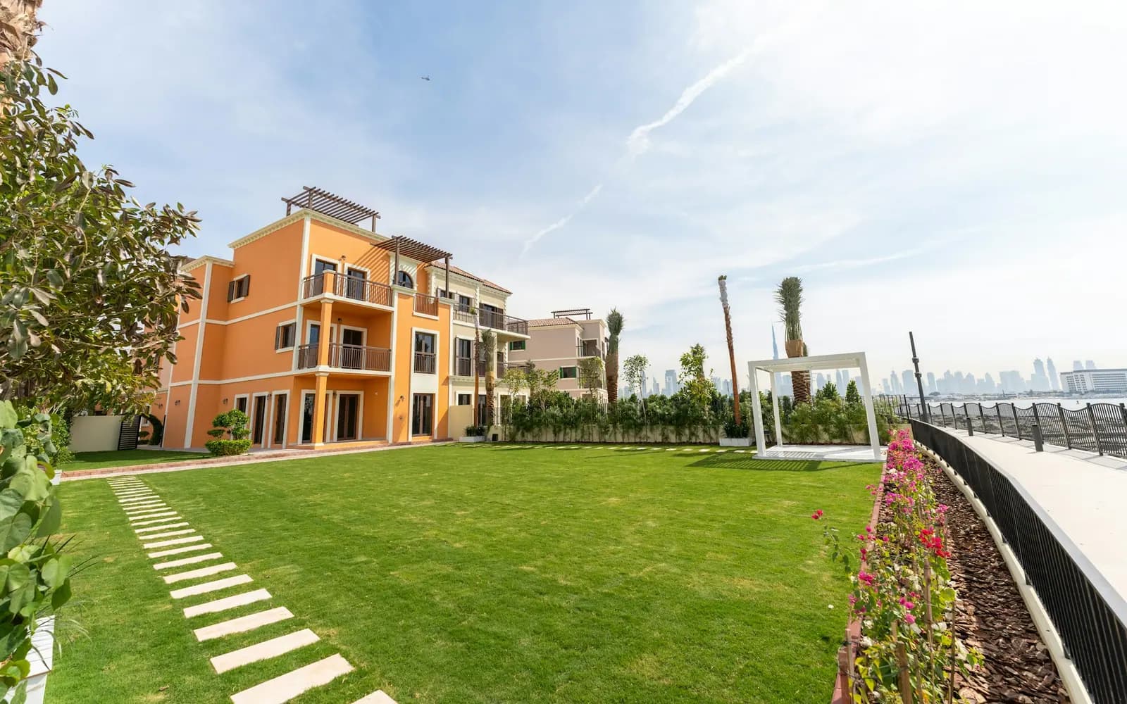Townhouse with a lawn and garden path